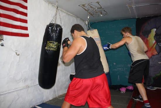 Boys punching bags in a gym