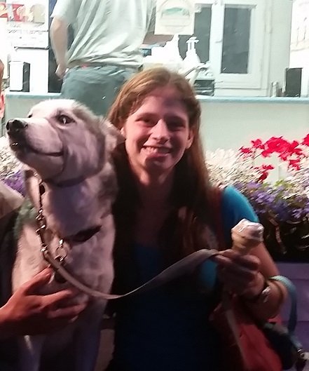 Julie enjoys ice cream at Donelly's with Atom, her favorite dog, a husky.