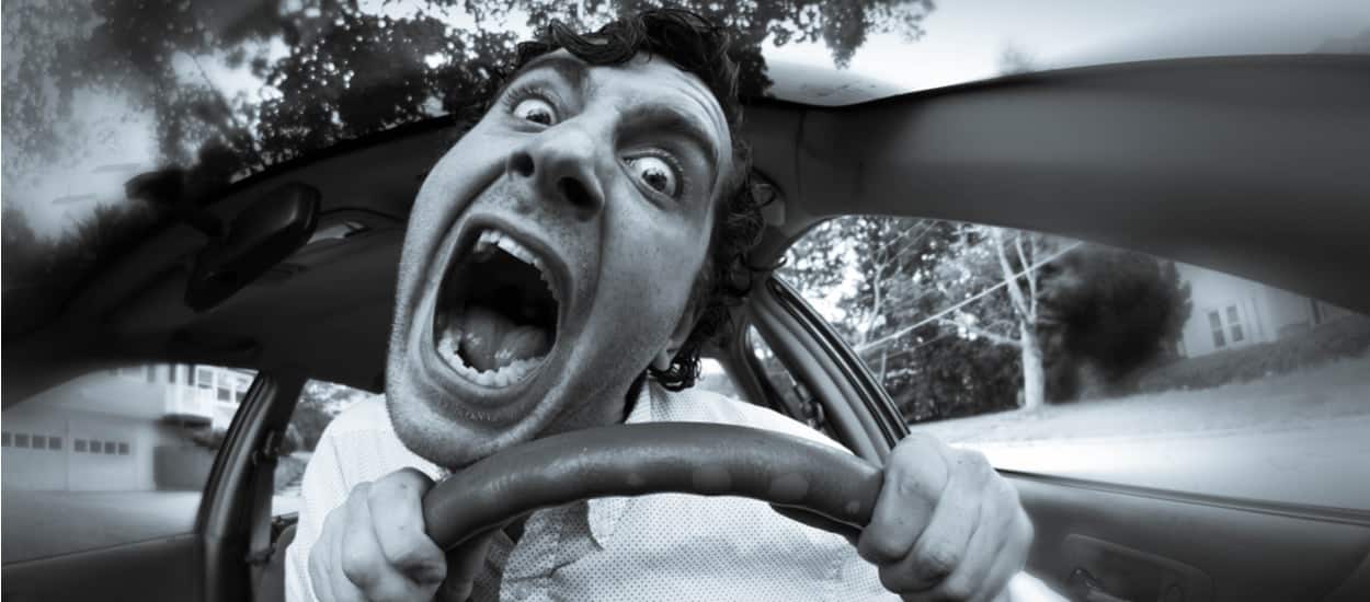man behind wheel having road rage