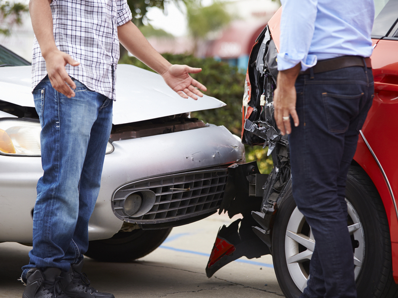 two-drivers-argue-after-car-accident-dented-fender