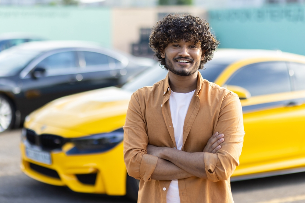 yellow car and owner
