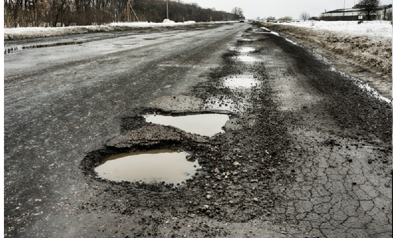 pothole-riddled street