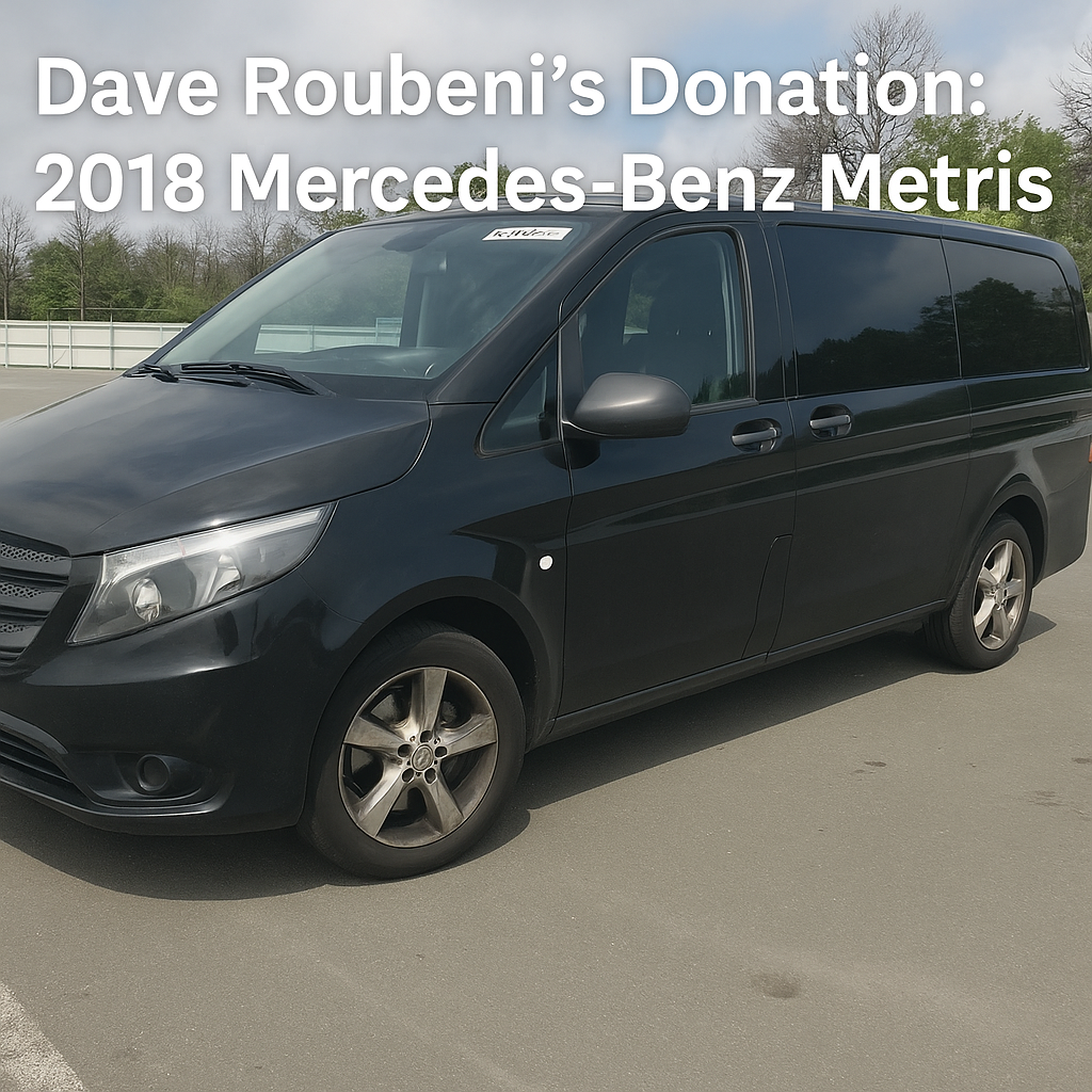 Front left side view of black 2018 Mercedes-Benz Metris minivan parked in a lot with text overlay: "Dave Roubeni’s Donation: 2018 Mercedes-Benz Metris".