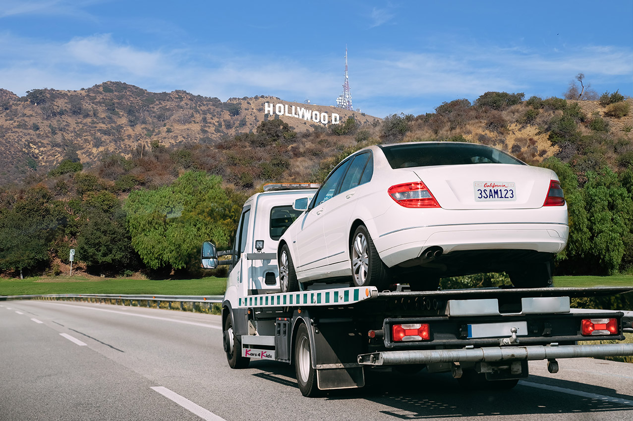 car that was donated being picked up in California by Kars4Kids