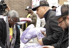 Cory Booker participates in a winter coat giveaway sponsored by Kars4Kids to benefit children in Newark
